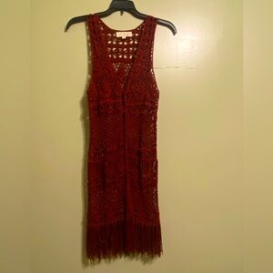 Burgundy color sleeveless knit sweater great over any top with jeans.